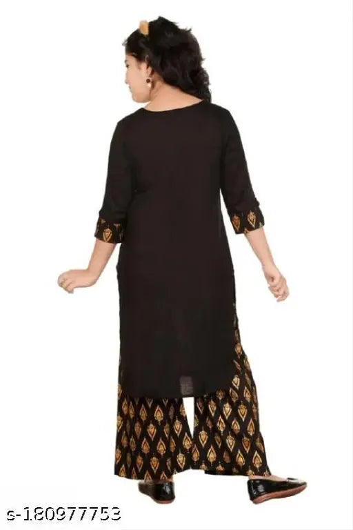 Black rayon kids kurtas and palazzos with printed design, three-quarter sleeves, floor length. Available in sizes 8-9 Years to 12-13 Years. Indian origin