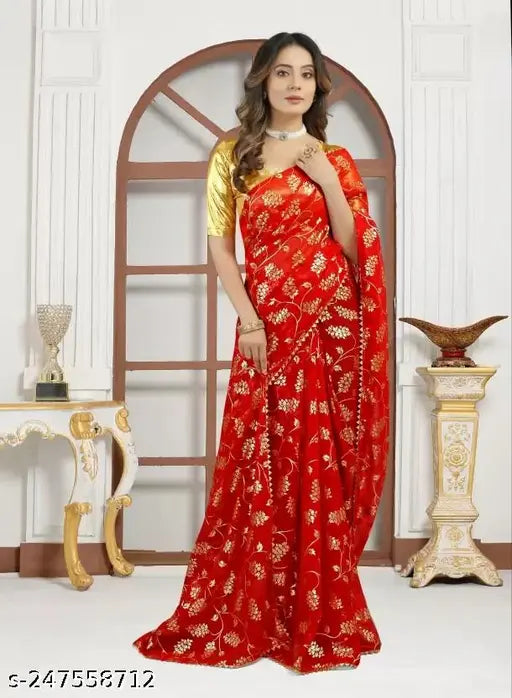 Red and gold sari with embroidery, gold blouse