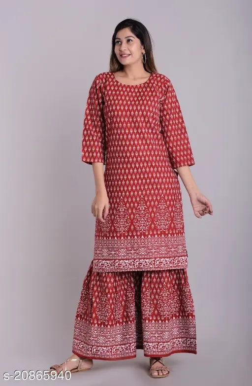 Red embroidered kurta with long flared pants, casual style