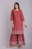 Red embroidered kurta with long flared pants, casual style