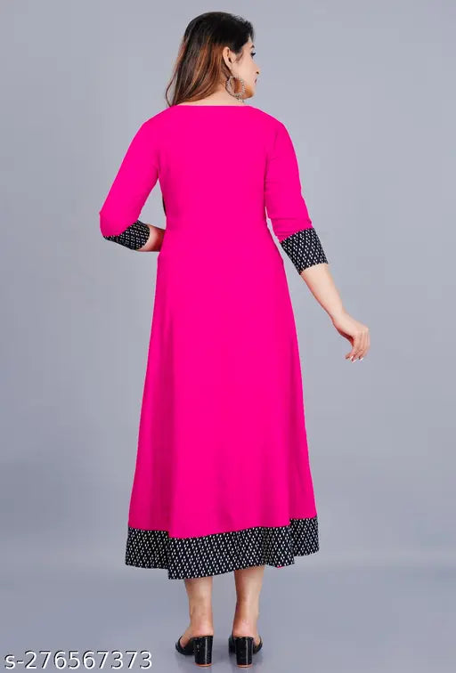 Pink rayon flared kurti with three-quarter sleeves, hand wash or machine washable. Size XS (Bust 34", Length 48") - XXXL (Bust 46", Length 48"). Casual to formal wear