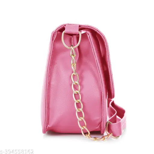 Pink leather crossbody purse with metal chain straps