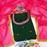 Green Georgette maxi dress with mirror work and stone embellishments, paired with pink digital-printed dupatta. Indian craftsmanship