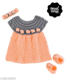 Orange handmade woolen sleeveless boat neck frock for baby girl by Love, embellished with cap and shoes in multiple sizes from India
