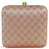 Pink quilted clutch with a gold clasp