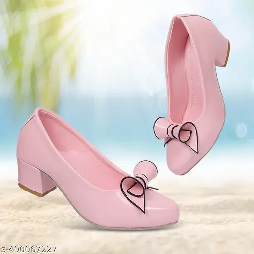 Pink slip-on flats with bow accents