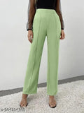 The image displays a pair of women's trousers in a light green or mint color, featuring high-waisted designs with a button and zipper closure, and what appears to be pockets on the front. They are displayed against a neutral background