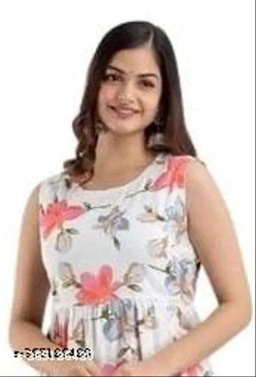 White flared rayon kurta with pink floral print, sleeveless and midi length, international women's fashion