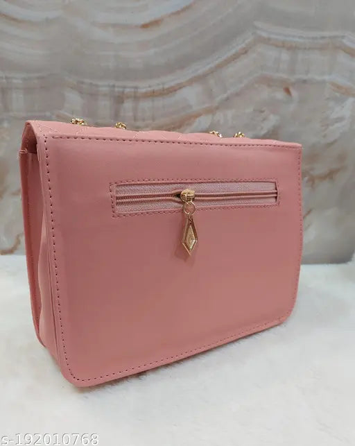 Pink leather sling bag with zipper closure and two pockets