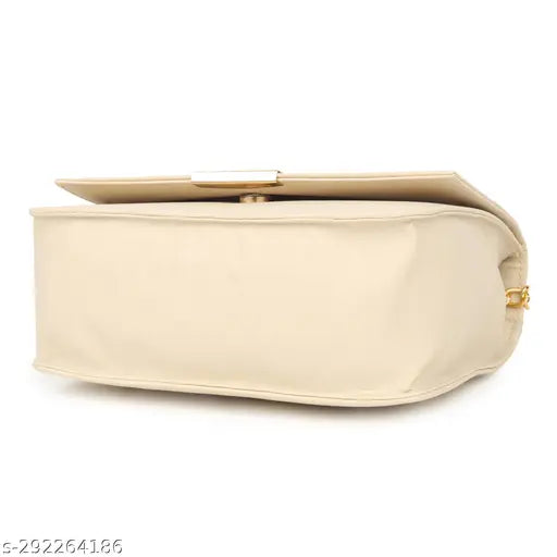 Gold buckle slingbag in light beige fabric, with multiple pockets and a zip closure