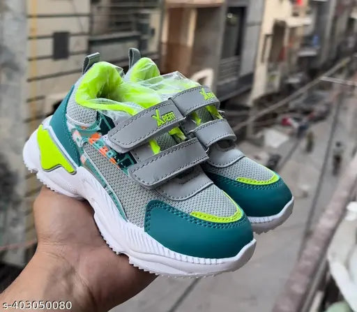 Stylish synthetic sports shoes for kids boys, ideal for play & parties, featuring Velcro fastening and anti-skid sole. Lightweight & comfortable. Size: 4-12 years. Indian origin