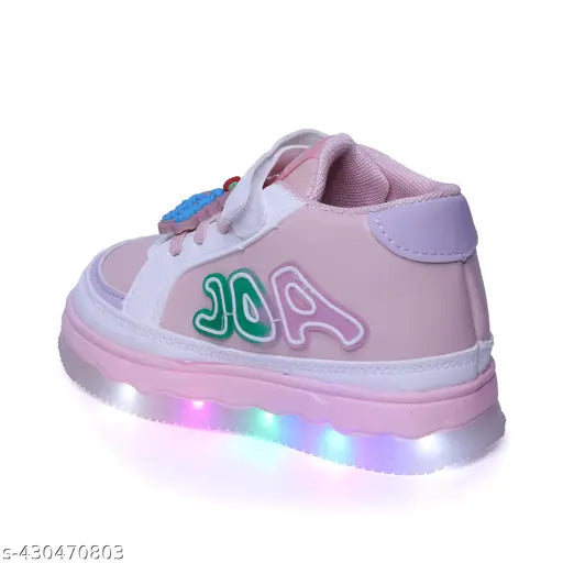 The new unisex LED kids shoes are on display, showcasing their vibrant pink and purple colors