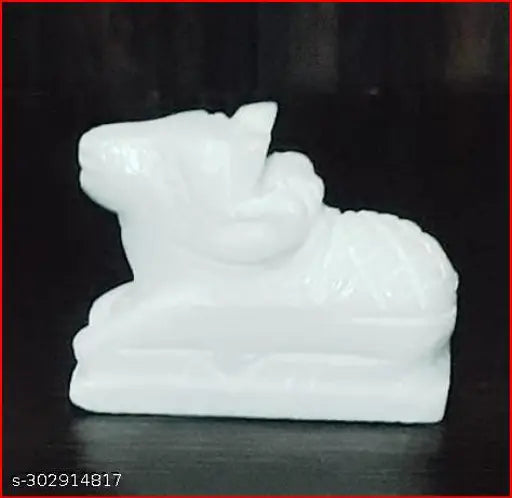 Handcrafted white marble Nandi idol from Sai Collection. Small 5cm statue for home puja, Shivratri or Saawan worship. White marble God Idol on display