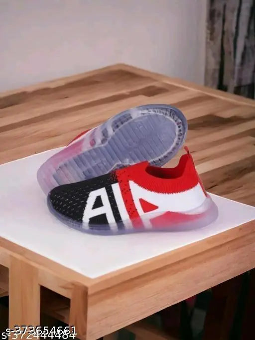 Clear shoe box with red and white Muku shoes