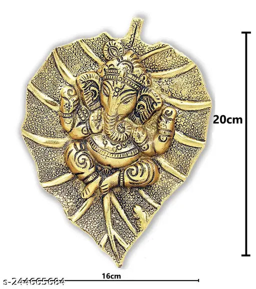 Golden handcrafted Ganesh Idol on peepal leaf, 20x16x3 cm white metal artpiece for home or office, good luck and auspicious beginning