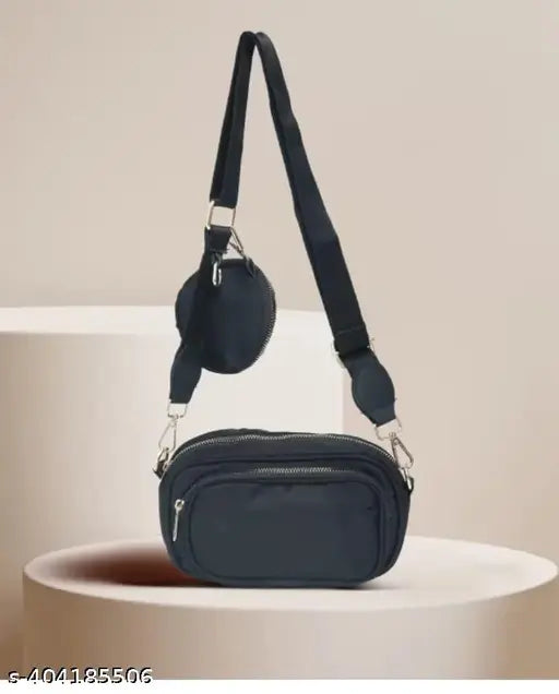 Black women's sling bag with strap, pockets, and zip closure