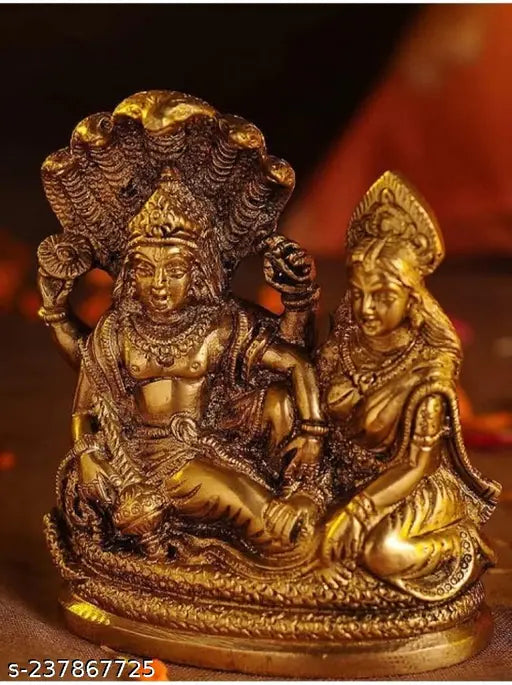 Gold plated metal statue of Laxmi and Narayan, intricate craftsmanship, religious item