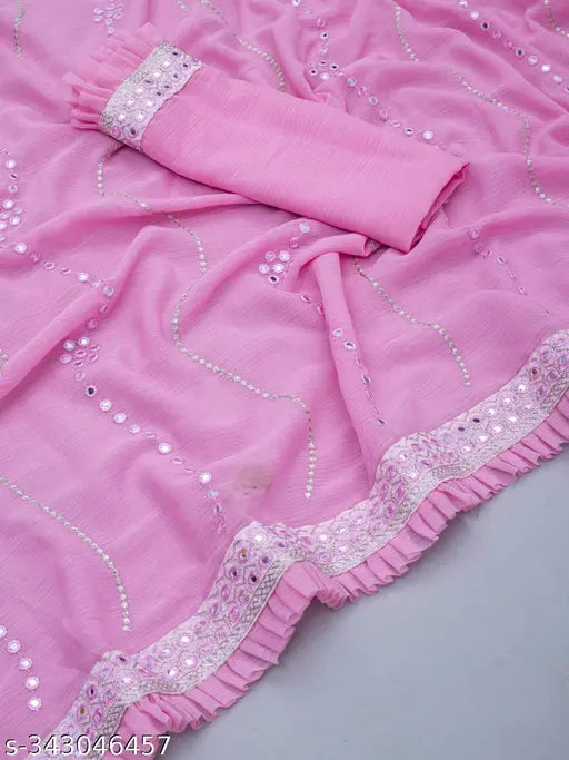 Pink saree with silver sequins and ruffled hem, displayed on a mannequin