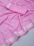 Pink saree with silver sequins and ruffled hem, displayed on a mannequin