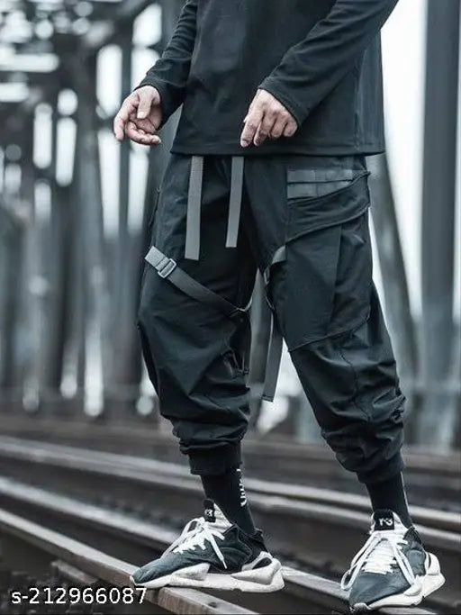 Black cotton cargo pants with elastic waist and camouflage pattern, featuring multiple pockets. Heavy Industry Tactical Webbing Darkwear Men's full-length trousers in sizes M/L/XL/XXL