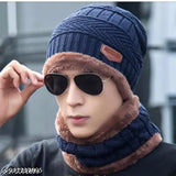 Navy knit beanie with fur trim and sunglasses