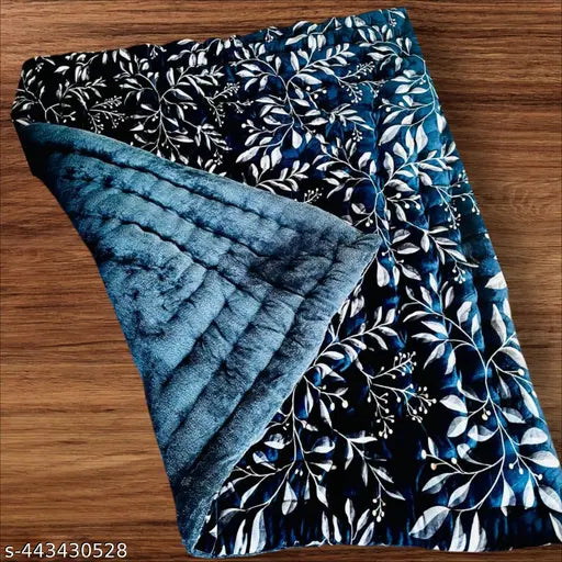 Blue quilt with intricate floral design