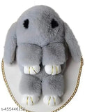 Grey stuffed animal in the shape of a bunny