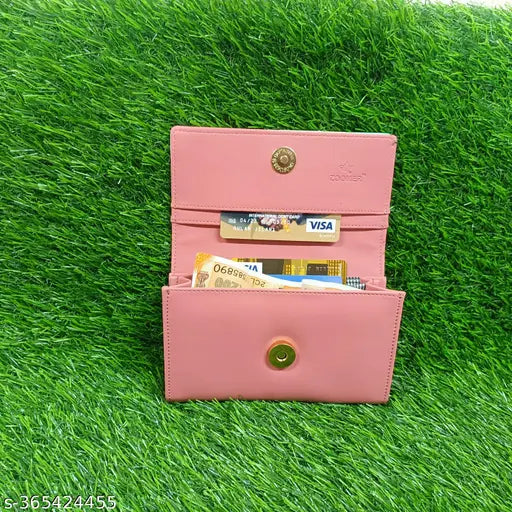 Pink wallet with multiple card slots, visible credit cards and change