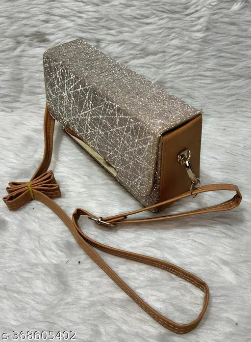 A ladies sling bag in a metallic glitter material
