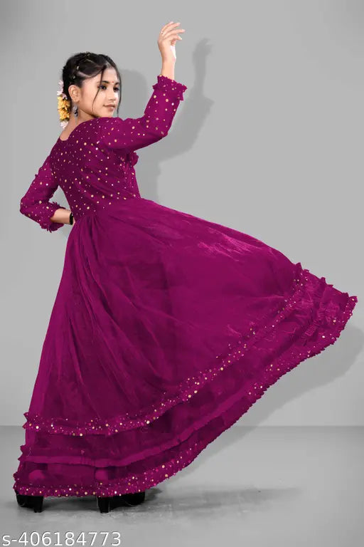 Fancy pink ethnic gown with dupatta, made of high-quality rayon fabric. Traditional Indian wear for parties or weddings, available in various sizes from 5-16 years. Origin: India