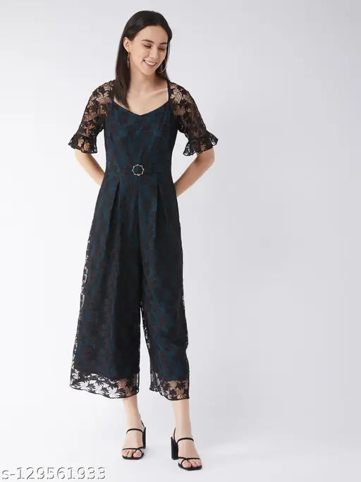 Black polyester self-design v-neck jumpsuit with short sleeves, featuring net pattern, lace overlay, frilled raglan sleeves, buckled waistband, and two side pockets. Color: black & teal. Made in India