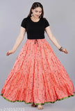 A woman in a long printed skirt