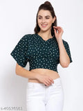 Green and white polka dot printed crepe regular crop top on model, women's size M (bust 36in, length 18in), made of polyester