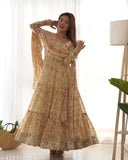 Yellow heavy pure soft fox georgette Anarkali kurta set with long sleeves, printed net pattern, and flair gown, paired with a 28-inch shawl-style dupatta featuring lace work. Indian wedding outfit for Haldi ceremony