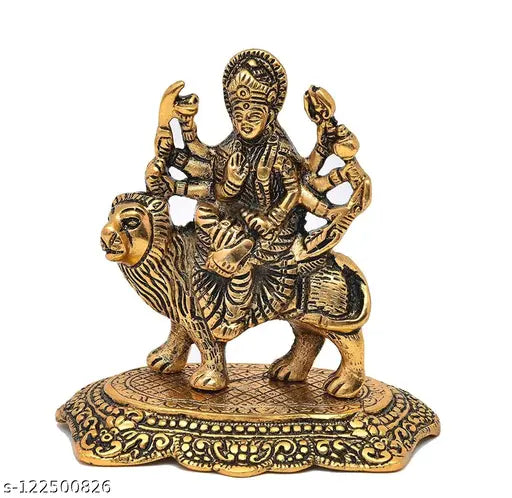 Carved metal depiction of Goddess Durga, Maa Shakti, on lion, as showpiece for pooja