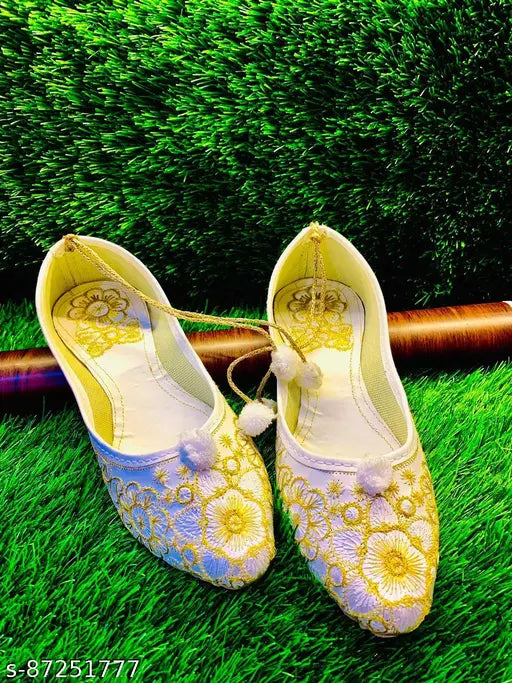 White synthetic embroidery flats, traditional appeal, comfortable fit for sizes IND-4 to IND-9. Made in India with quality assurance