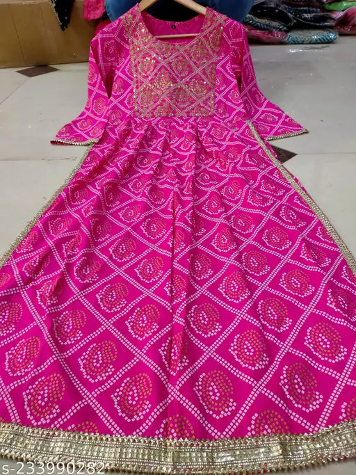 Viscose rayon kurta with Nyra cut, zari embroidery, bandhani print, three-quarter sleeves. Indian traditional wear