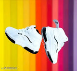 The image showcases white shoes with black accents. The shoes are displayed against a vibrant rainbow background