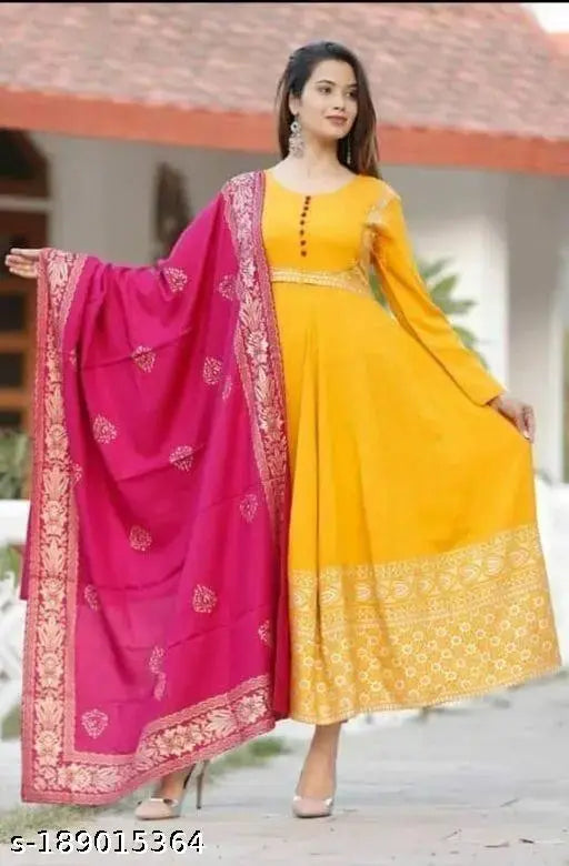 Yellow rayon anarkali kurti with pink dupatta, plus size for Haldi and Mehndi ceremonies. Rayon fabric, three-quarter sleeves, unique printed design. Perfect for daily wear and special occasions. LEELA Brand Jaipuri Kurtis, India origin