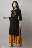 Woman in black kurta with flared bottoms and yellow dupatta