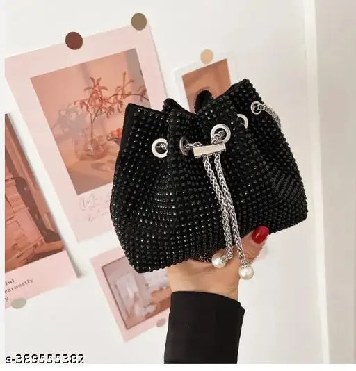Black and silver studded leather sling bag