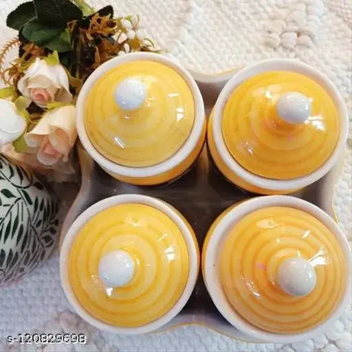 Yellow ceramic multipurpose storage containers in a set of four, each with a lid and placed on a tray, 500ml capacity, 4 inch diameter