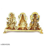 Gold-plated brass decorative idols of Laxmi Ji, Ganesh Ji, and Saraswati Ji with diya, ideal for home or office pooja decor. Traditional and antique finish design inspired by royal touch