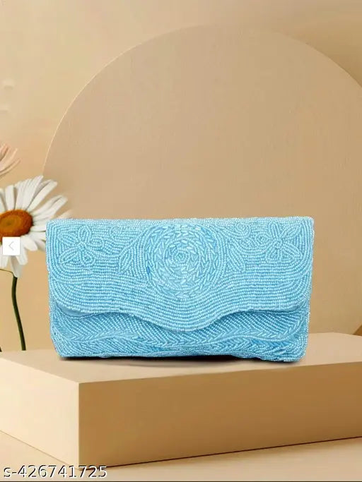 Light blue fabric with ornate beading, clutch purse