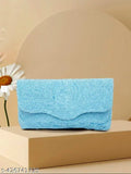 Light blue fabric with ornate beading, clutch purse