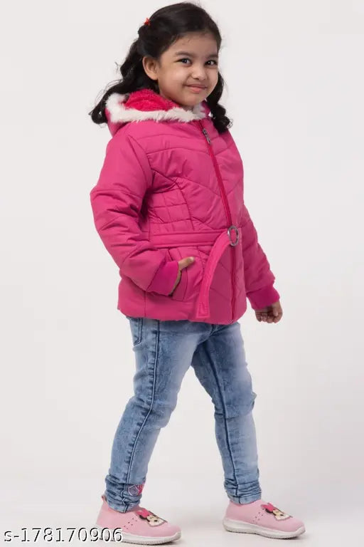 Girl in pink jacket, standing, smiling
