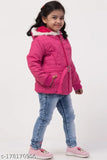 Girl in pink jacket, standing, smiling