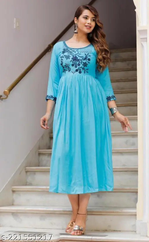 Mint rayon blouse with three-quarter sleeves, embroidered pattern. S (36 in bust), M (38 in bust), L (40 in bust), XL (42 in bust), XXL (44 in bust), XXXL (46 in bust), 4XL (48 in bust), 5XL (50 in bust). Indian-made top