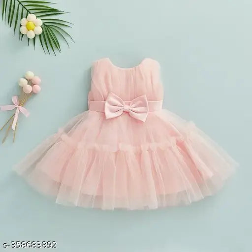 Pink tulle tutu with bow, suitable for parties or events, 2-4 years