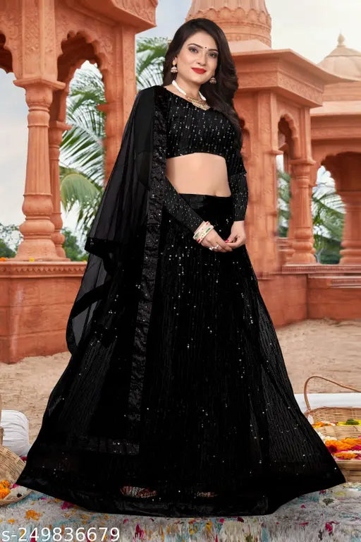Black net embroidered Lehenga Choli set with blouse and dupatta, featuring intricate work on net fabric. Perfect for traditional occasions like weddings or festivals. Indian design with embellished top, embroidered dupatta, and solid black dupatta